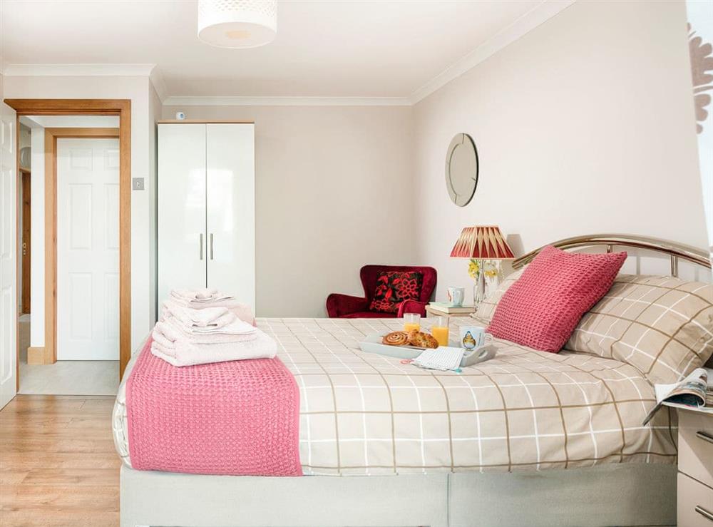 Double bedroom that leads into the conservatory (photo 3) at Dylmor in Benllech , North Wales, Gwynedd