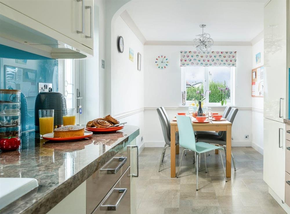 Open dining area/ kitchen at Dylmor in Benllech , North Wales, Gwynedd