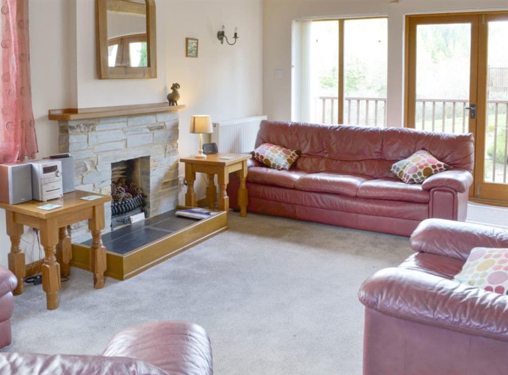 Spacious living area with access to balcony at Eagles Nest in St Mellion, near Saltash, Cornwall