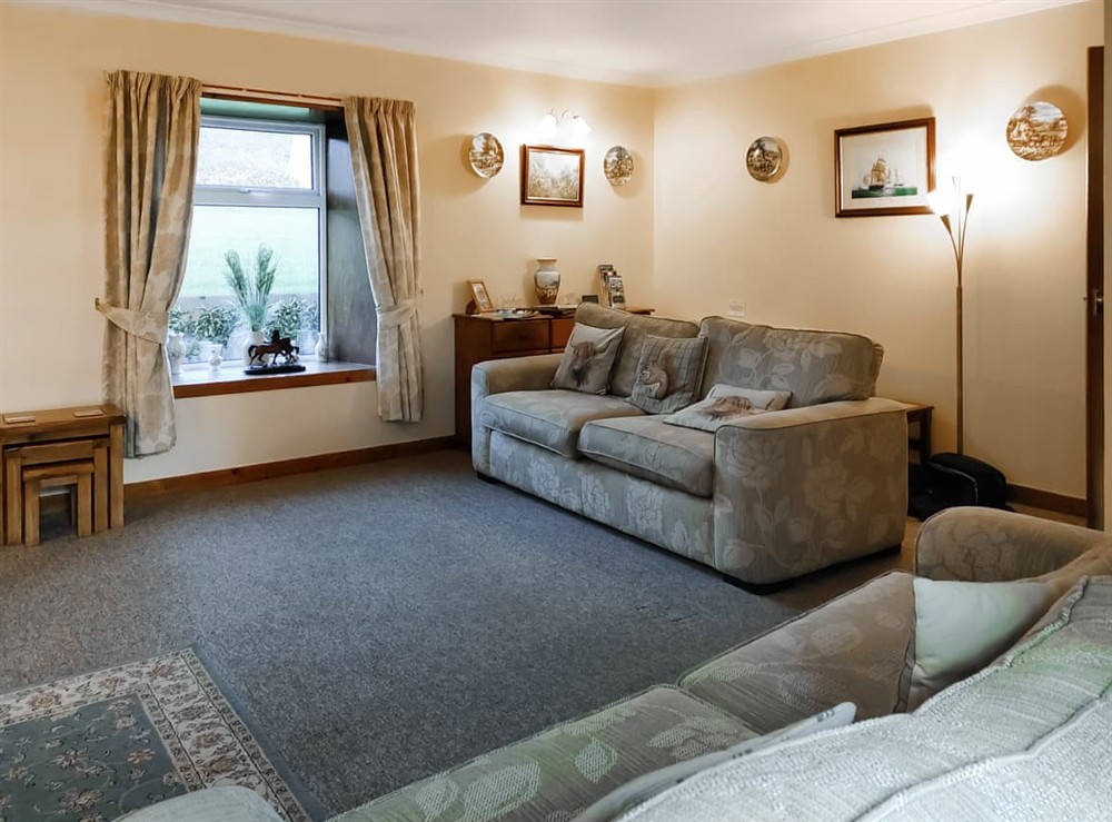 Living room at East Challoch Farm Dairy Cottage in Stranraer, Wigtownshire