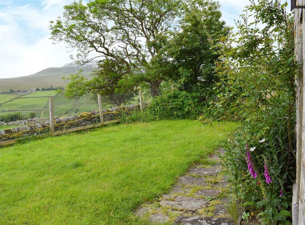 Large lawned garden area at East Cottage in Booze, near Reeth, North Yorkshire