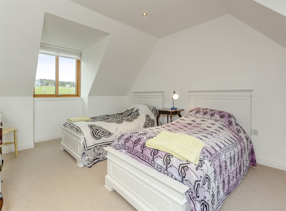 Twin bedroom at East Cottage in Cawdor, Morayshire