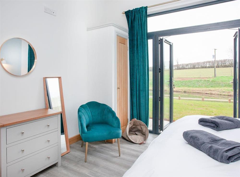 Double bedroom (photo 2) at East Dunster Deer Farm – Kingfisher Lodge in Cadeleigh, Devon