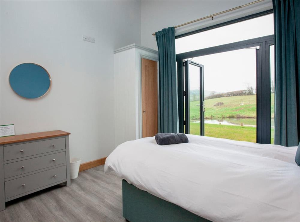 Twin bedroom (photo 4) at East Dunster Deer Farm – Kingfisher Lodge in Cadeleigh, Devon