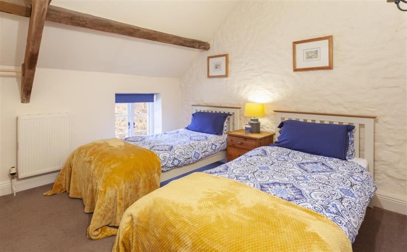 A bedroom in East Harwood Farm Cottage at East Harwood Farm Cottage, Timberscombe