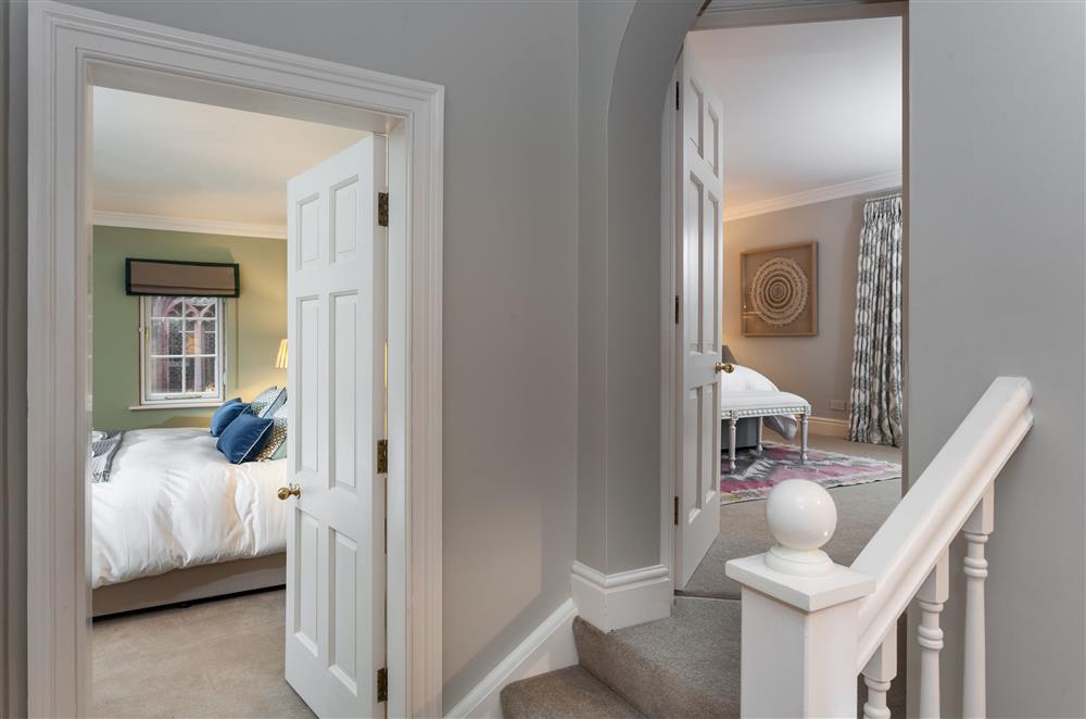 Two steps lead up to bedroom one at East House, Arley