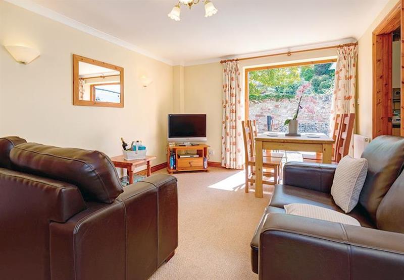 The living room at Horseshoe Cottage at Eastdon Estate in Dawlish, Devon