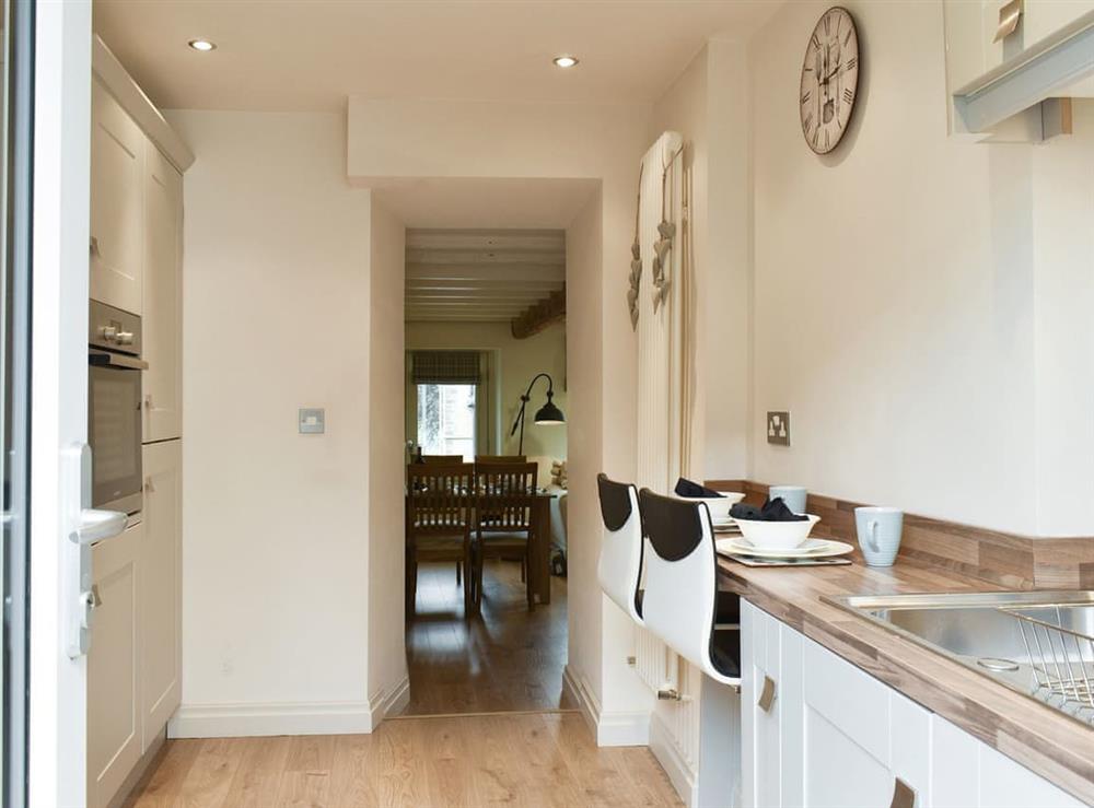 Well-equipped kitchen with casual dining space at Easter Cottage in Bamford, near Hope Valley, Derbyshire