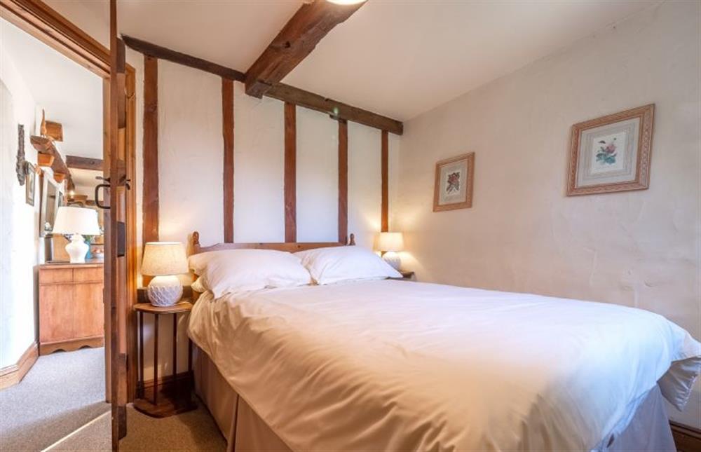 Ground floor: Bedroom one, double bed and garden view at Eastgate Barn, Holme-next-the-Sea near Hunstanton