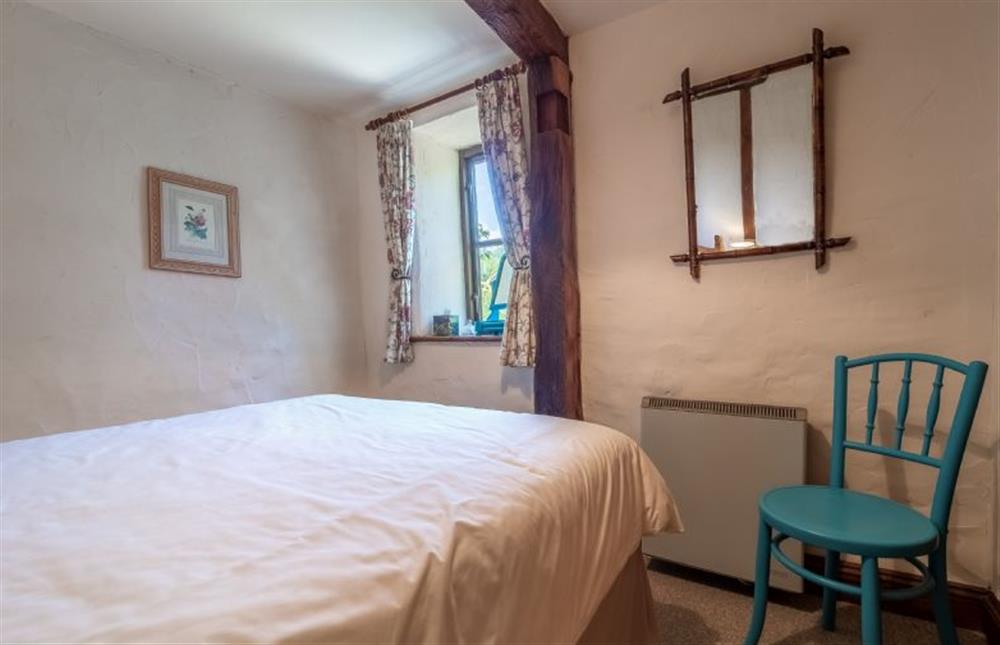Ground floor: Bedroom one, double bed has built-in cupboard at Eastgate Barn, Holme-next-the-Sea near Hunstanton