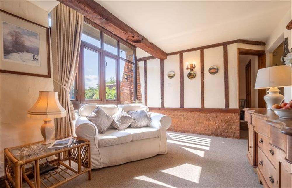 Ground floor: Comfortable Sitting room with exposed beams at Eastgate Barn, Holme-next-the-Sea near Hunstanton