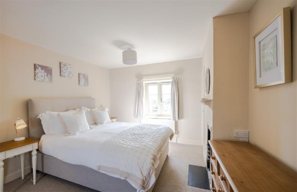 First floor: The comfortable master bedroom at Eastgate Cottage and Hideaway, Salthouse near Holt