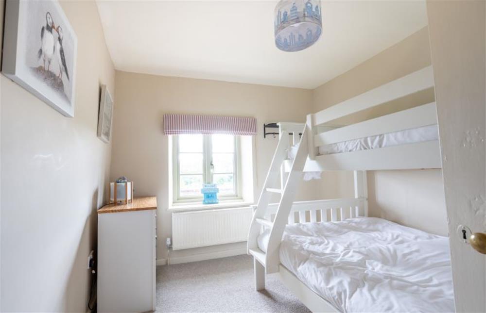 First floor: Bunk bedroom with double below and single above at Eastgate Cottage, Salthouse near Holt