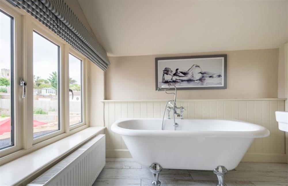 First floor: Family bathroom has a roll-top bath at Eastgate Cottage, Salthouse near Holt