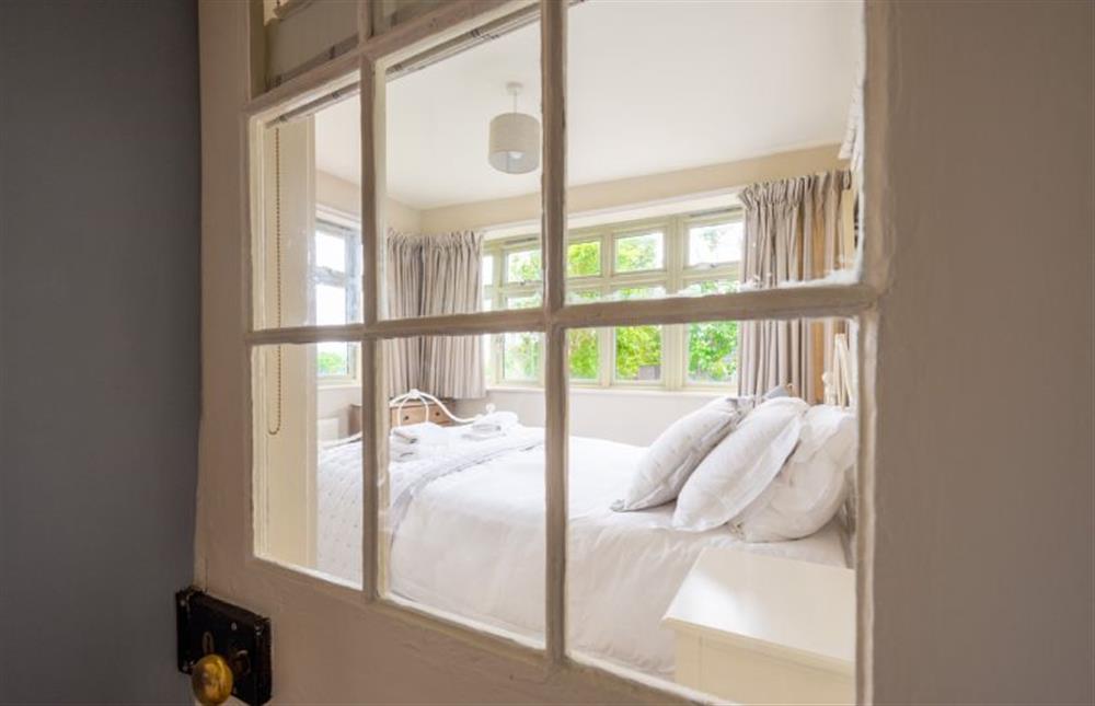 Ground floor:  Door into the King-size bedroom at Eastgate Cottage, Salthouse near Holt