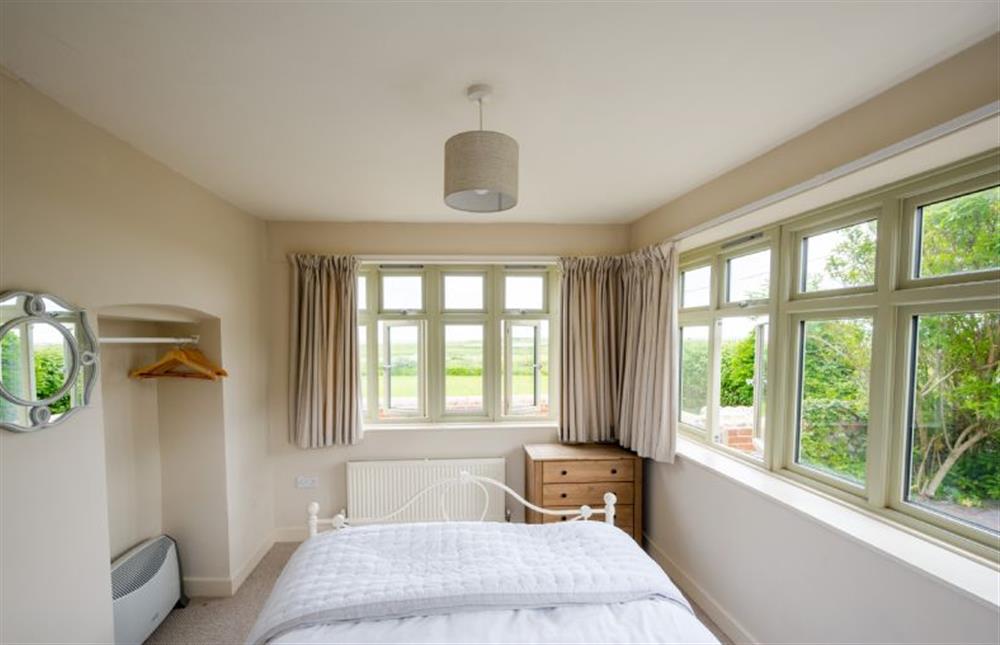 Ground floor: The bedroom has fabulous views to the marsh and sea at Eastgate Cottage, Salthouse near Holt
