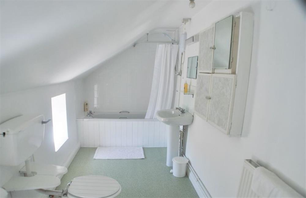 Family bathroom with shower over bath at Eaton Cottage, Thornham near Hunstanton