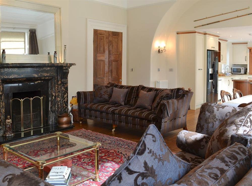 Characterful living area with feature fireplace at Ebbe Retreat in Beadnell, Northumberland