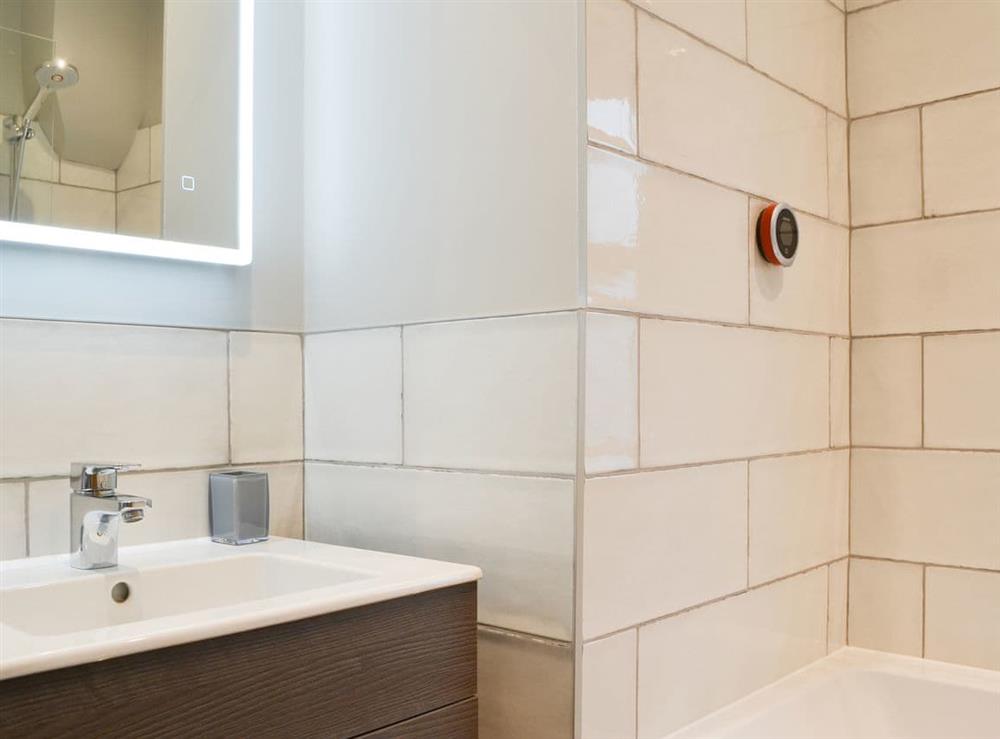 Illuminated mirror above the washbasin