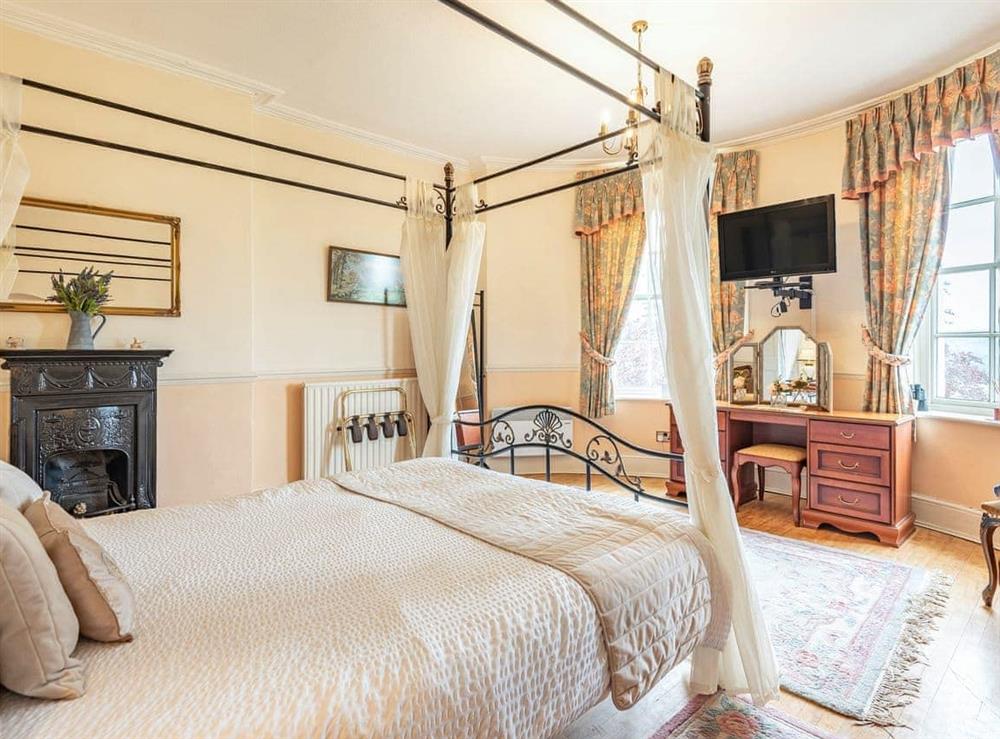 Four Poster bedroom at Edderton Hall Country House in Welshpool, Powys
