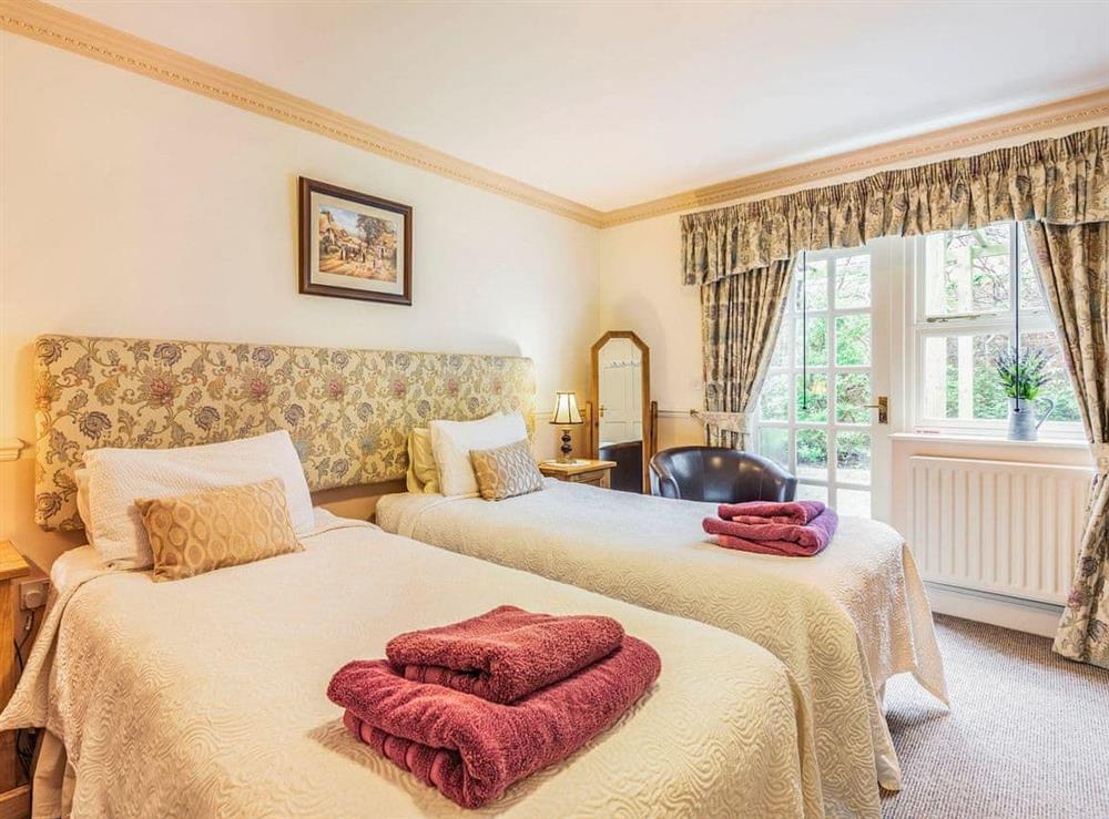 Twin bedroom at Edderton Hall Country House in Welshpool, Powys
