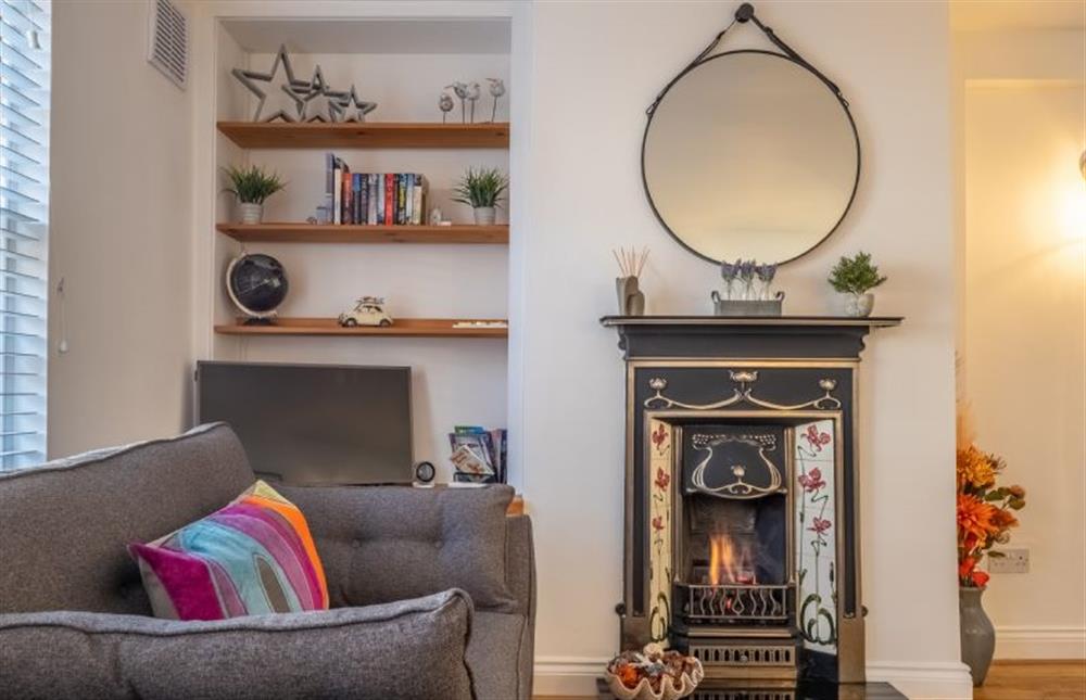 A pretty fire surrounds the gas fire - ideal for taking off the chill at Eden Cottage, Wells-next-the-Sea