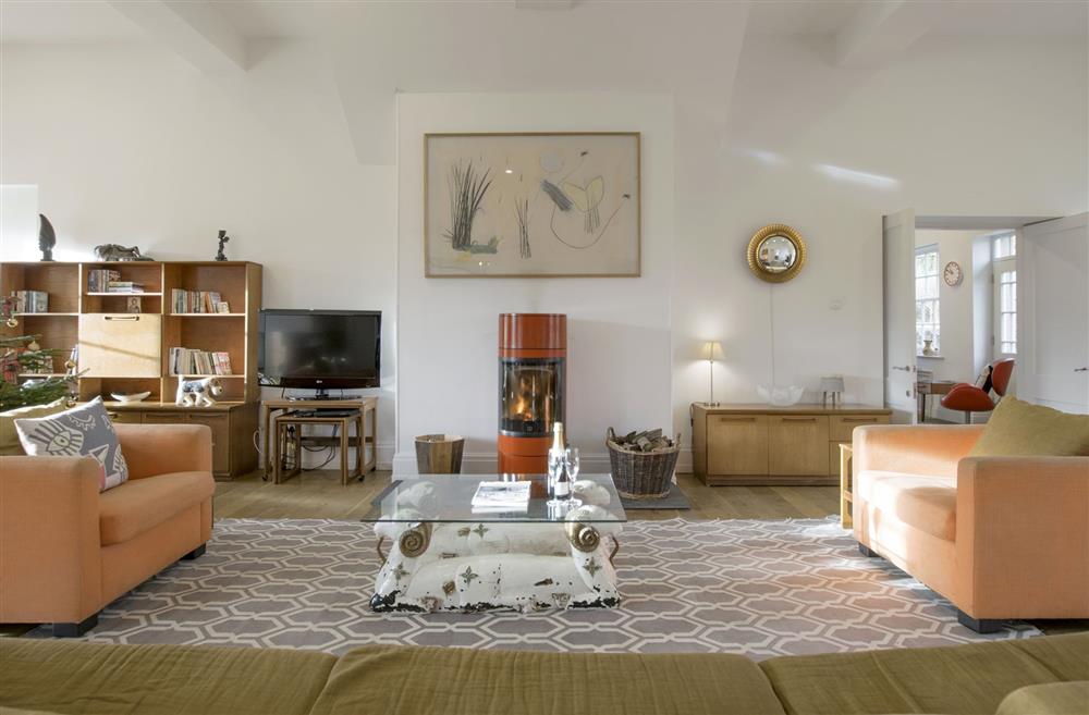 Sitting room featuring vibrant red wood-burning stove