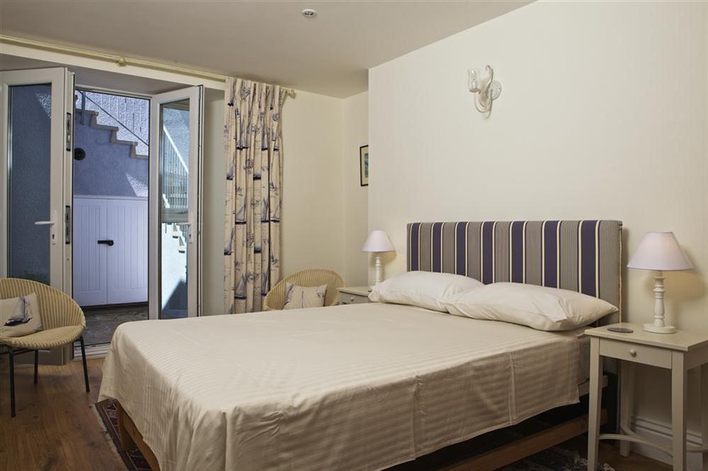 Second double bedroom with access to small courtyard at Edinburgh House in , Salcombe