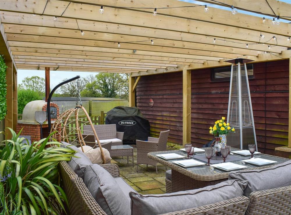 Outdoor eating area at Egmont Farmhouse in Northiam, near Rye, East Sussex