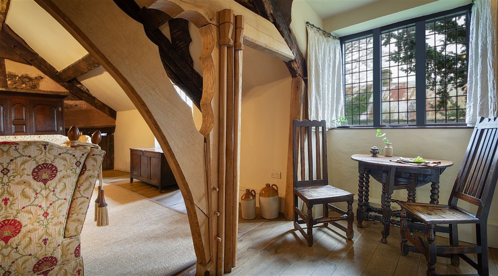 The small dining table for two in the medieval hall sitting room at Egryn in Nr Barmouth, Gwynedd