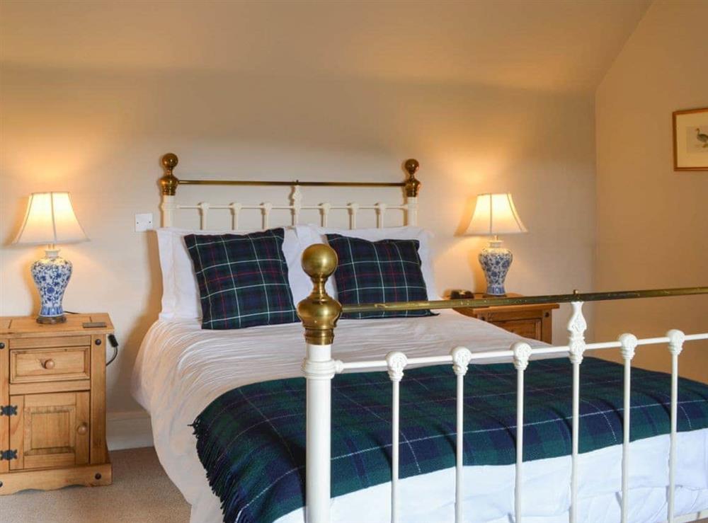 Delightful double bedroom with antique style bed at Einich in Newtonmore, near Aviemore, Inverness-Shire
