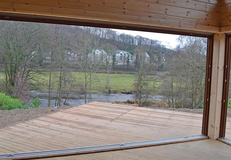 Views from a Kestrel Lodge to the river at Eirianfa Country Park in Llangollen, North Wales