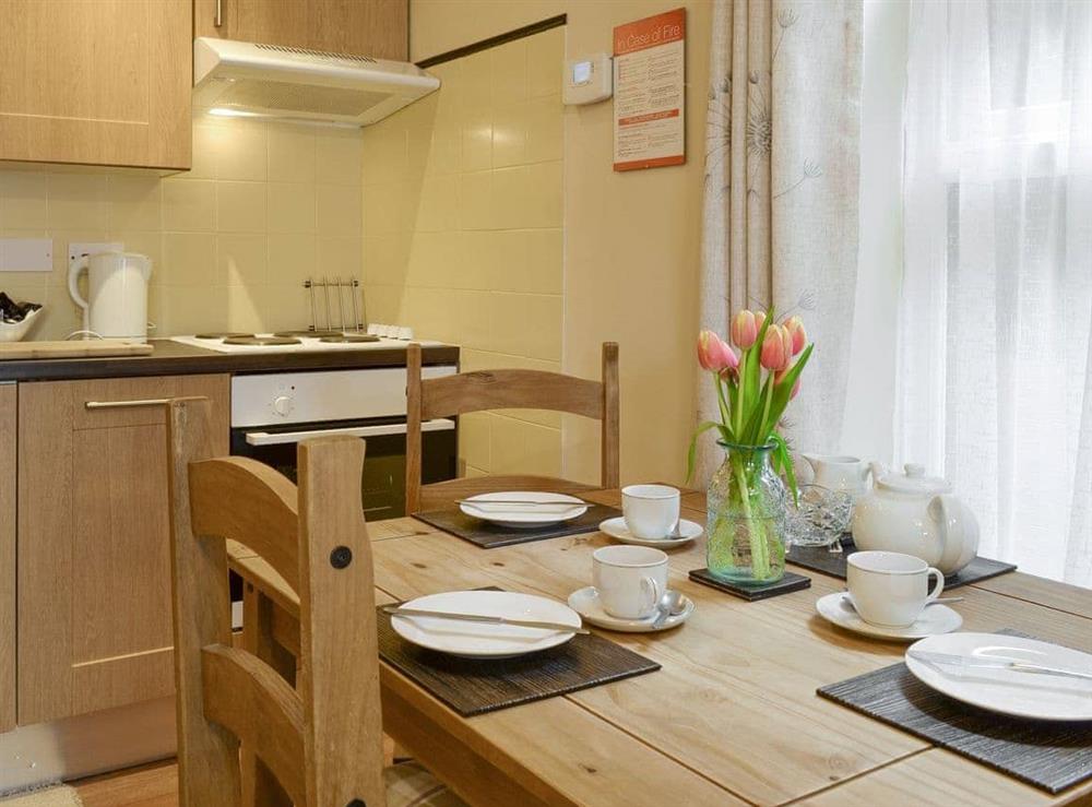 Attractive dining area and kitchen at Cottage One, 