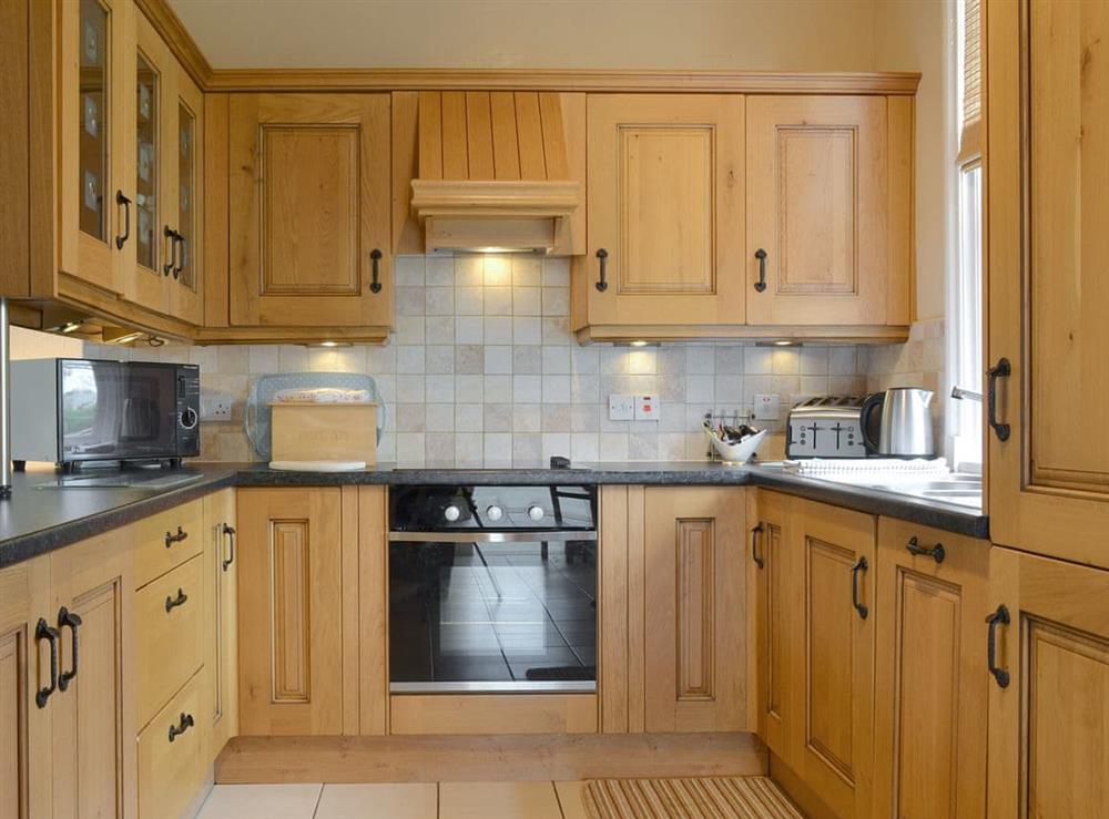 Well-equipped fitted kitchen at The Gatehouse, 