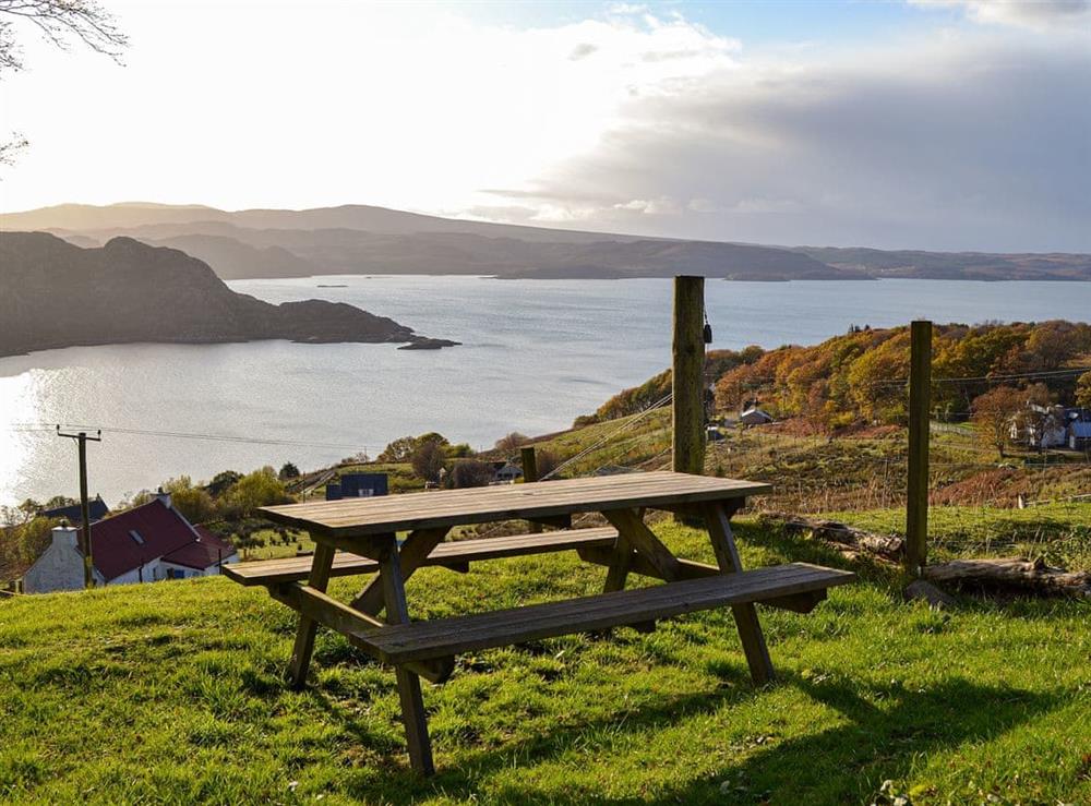 Outdoor seating area with wonderful views at Eleven Diabaig Cottage in Diabeg, near Torridon, Ross-Shire