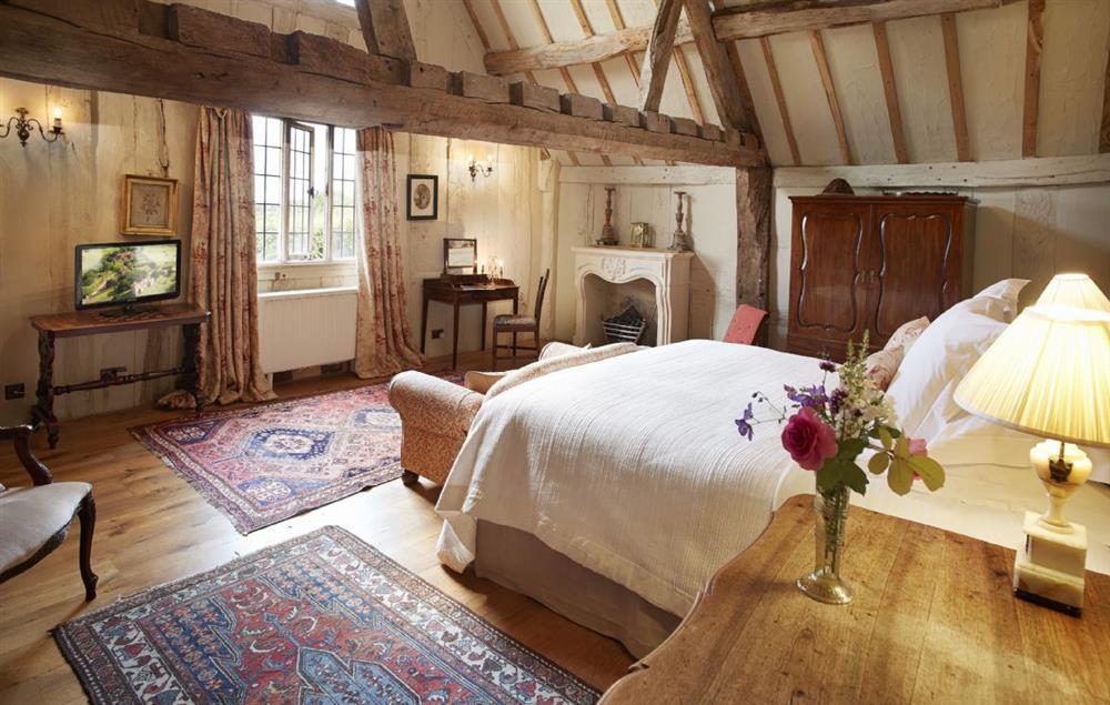 Spacious 6’ Super King double bedroom with views over the Cloister Garden and quince trees at Elinor Fettiplace, Pauntley