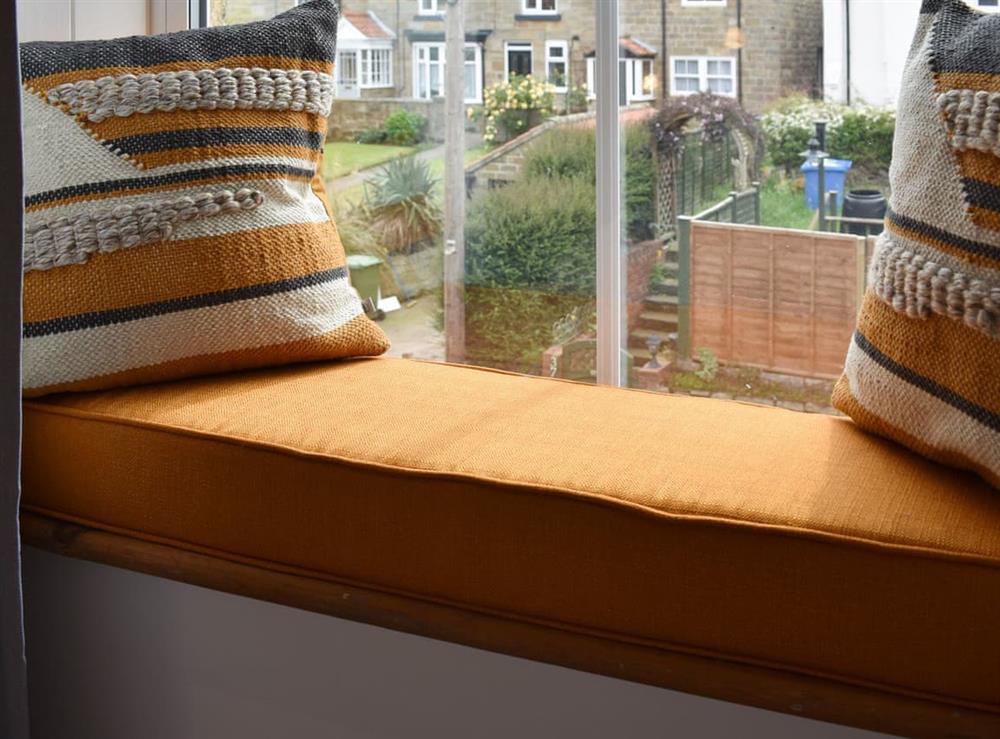 Window seat within double bedroom at Elizabeth Cottage in Hinderwell, near Whitby, North Yorkshire