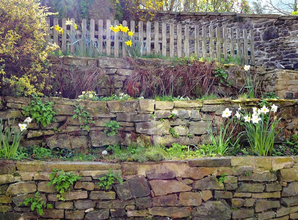 Charming enclosed garden at Ellers Bank in Hayfield, near Glossop, Derbyshire