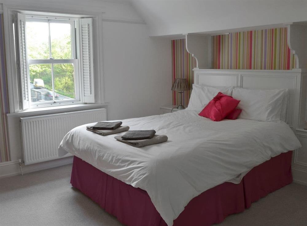 Contemporary bedroom with king-size bed at Ellerside in Cark, near Cartmel, Cumbria
