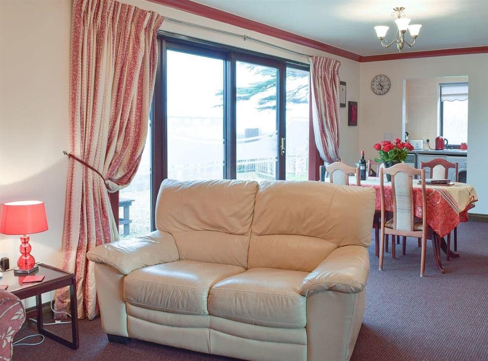 Comfortable sofa and patio doors to the garden at Elm View, 