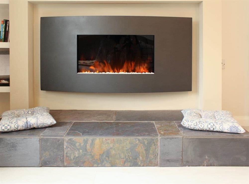 Contemporary wall mounted fire at Elm Court in Keswick, Cumbria