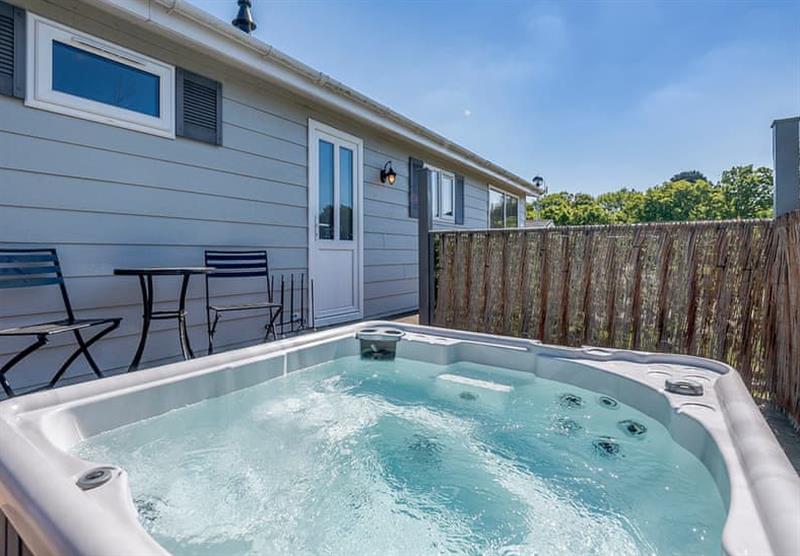 A private hot tub in the La Belle Maison 6 at Elm Farm Country Park in Thorpe-Le-Soken, Essex