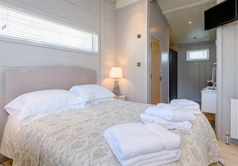 One of  the bedrooms in the La Belle Maison 6 at Elm Farm Country Park in Thorpe-Le-Soken, Essex