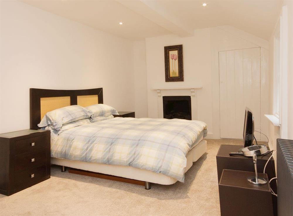 5’ double bed and dressing area make the master bedroom luxurious and romantic at Elm Grove in Dartmouth, Devon
