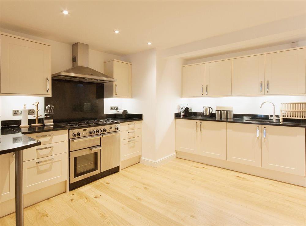 A range cooker is just one of the modern appliances in the well-stocked kitchen at Elm Grove in Dartmouth, Devon