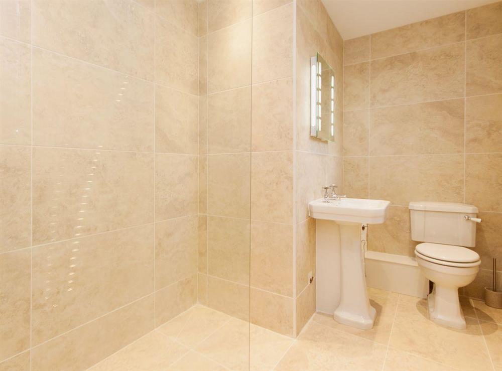 An en suite shower room, full tiled, is a great addition to the master bedroom at Elm Grove in Dartmouth, Devon