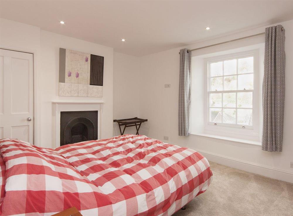 Light, bright, and comfortably furnished, the second double bedroom is welcoming at Elm Grove in Dartmouth, Devon