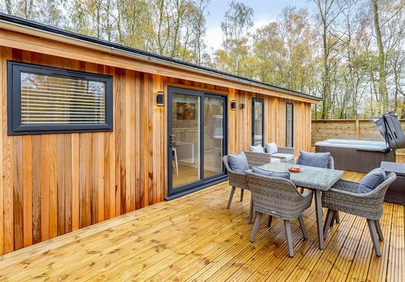 The decked area with a hot tub in Foxy at Elton Furze Retreats in Haddon, Peterborough