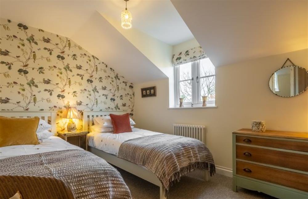 First floor: Bedroom two with full-size single beds at Ember Cottage, Litcham near Kings Lynn