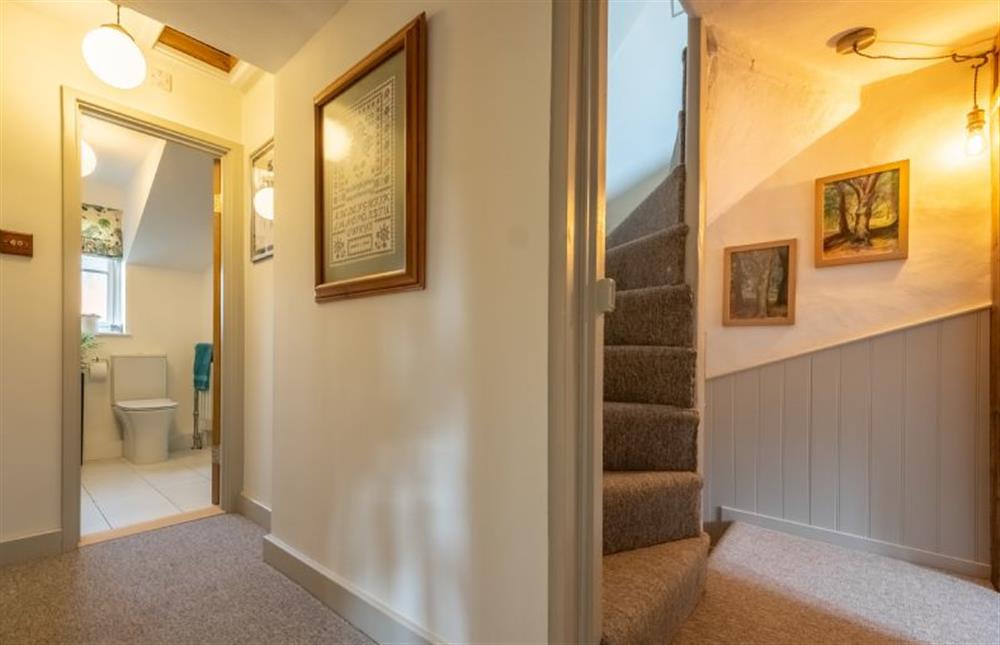 First floor: Landing with stairway to the second floor at Ember Cottage, Litcham near Kings Lynn